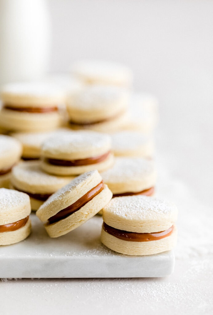 Learn how to make Traditional Alfajores with this easy recipe. These melt-in-your-mouth Dulce de Leche filled cookies are a popular dessert throughout Latin America.