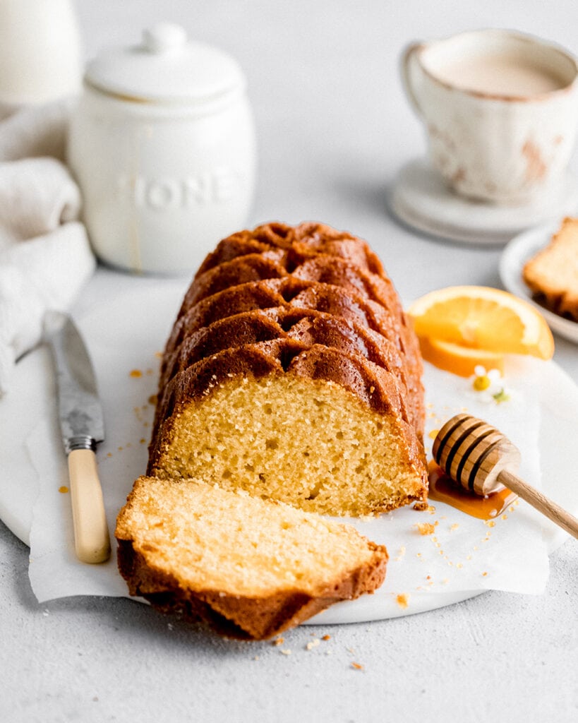 Soft and velvety orange pound cake made with freshly squeeze orange juice and zest. Perfect for a morning snack or brunch dessert. 