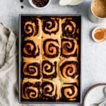 Soft and pillowy chocolate cinnamon rolls topped with a creamy condensed milk glaze.