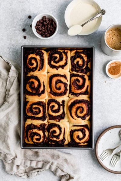 Soft and pillowy chocolate cinnamon rolls topped with a creamy condensed milk glaze.