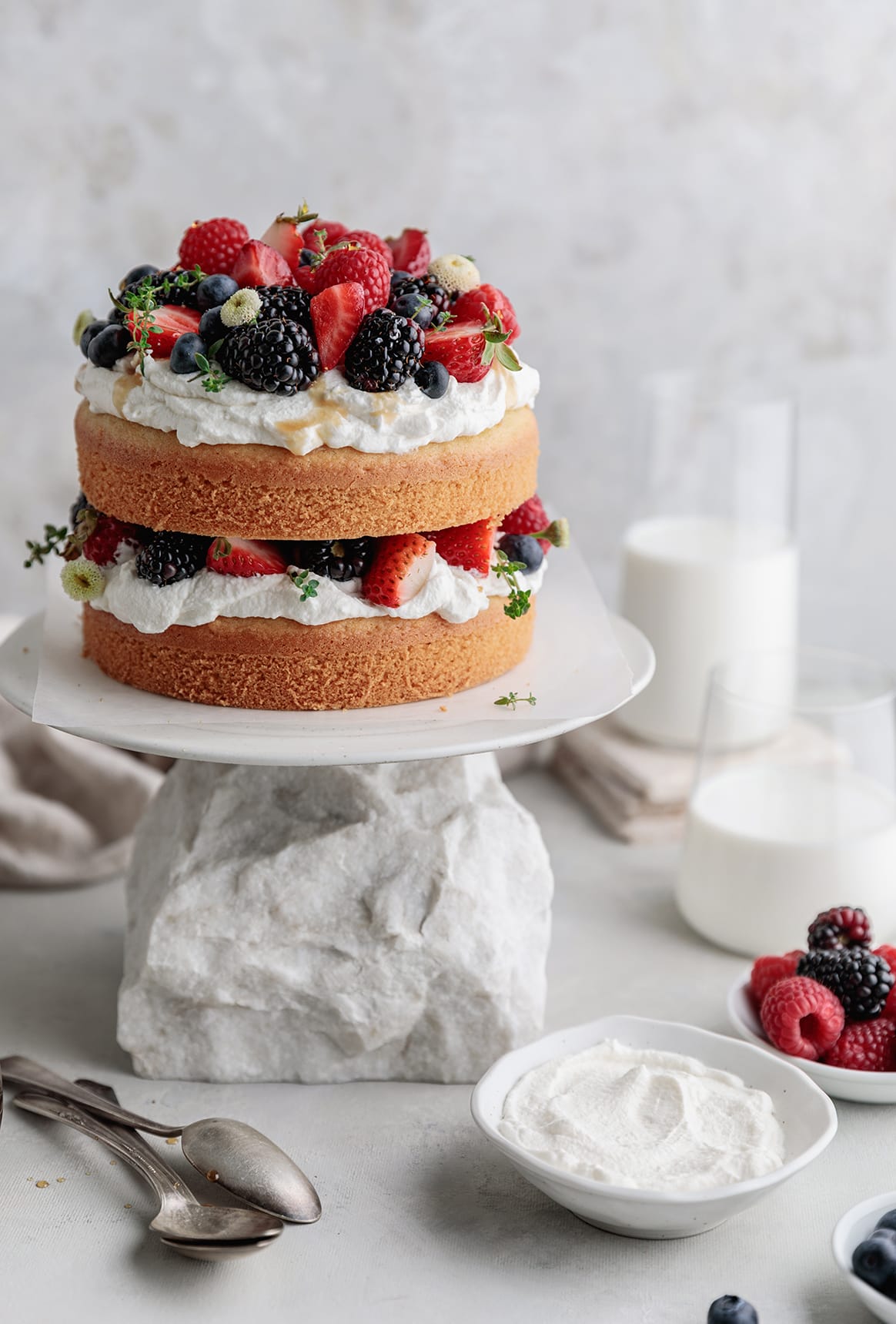 https://yogaofcooking.co/wp-content/uploads/2020/08/layered-almond-cake-with-berries-1.jpg