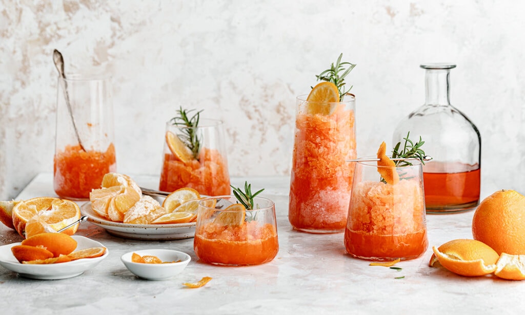 Sweet and citrusy Minneola Aperol Granita is the perfect refreshing drink on a hot summer day!