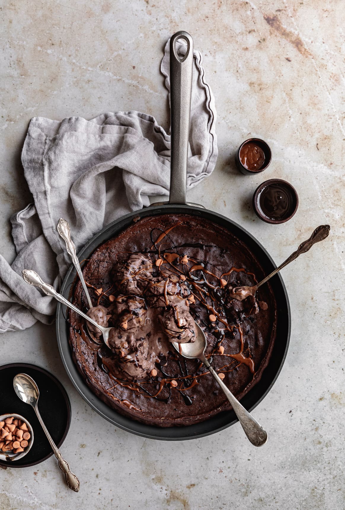 This warm Triple Chocolate Dutch Baby with a puffy center and crispy edges, served with chocolate ice cream, makes  the perfect shareable dessert any time of the year!