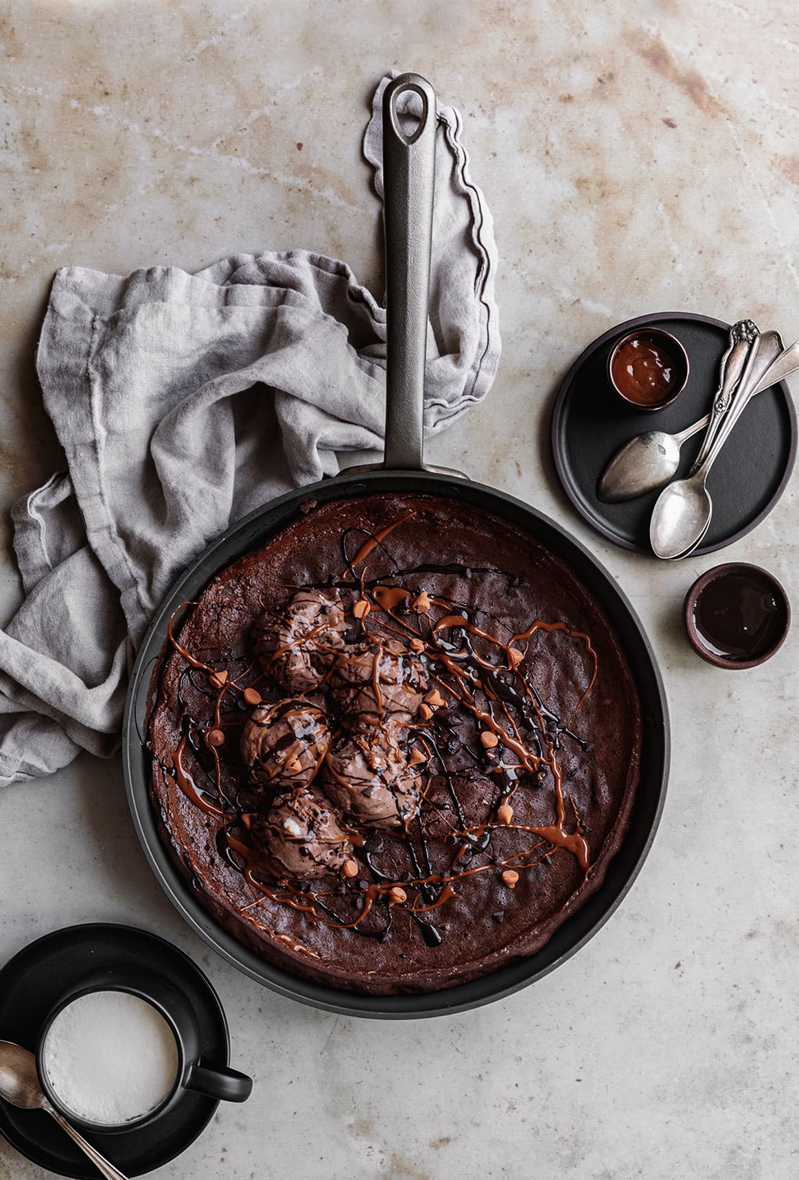 This warm Triple Chocolate Dutch Baby with a puffy center and crispy edges, served with chocolate ice cream, makes the perfect shareable dessert any time of the year!