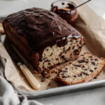 sliced chocolate chip loaf with chocolate ganache