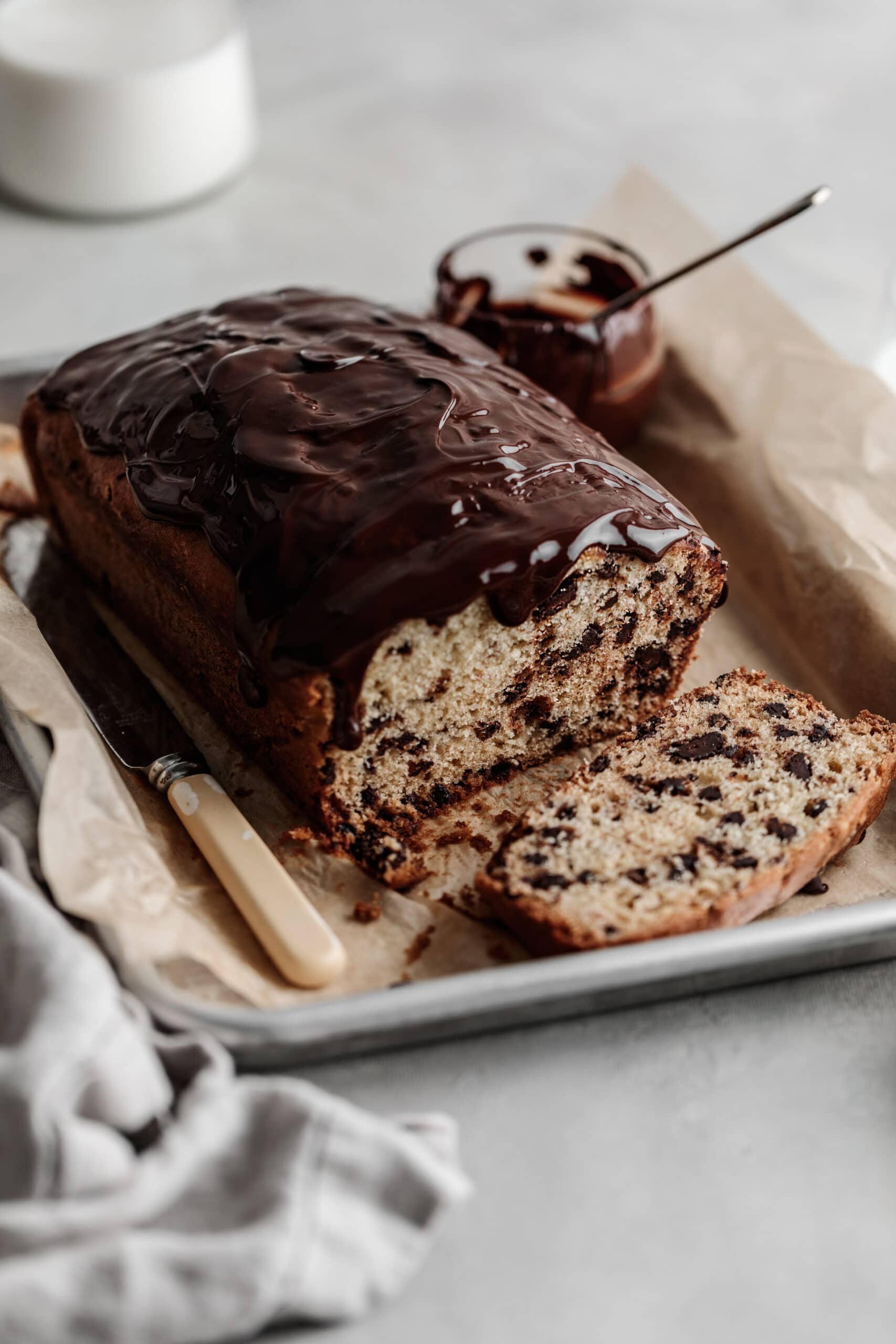 sliced chocolate chip loaf with chocolate ganache