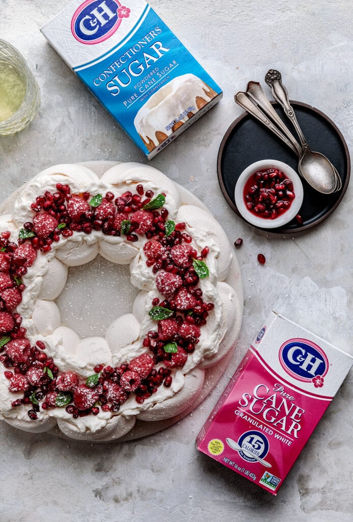 A delicate and crunchy shell with a marshmallowy center, this Pavlova Wreath with Almond Cream and Raspberries is the most beautiful holiday dessert you'll ever make!