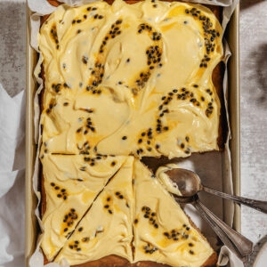 sliced peanut butter banana bread with passion fruit frosting