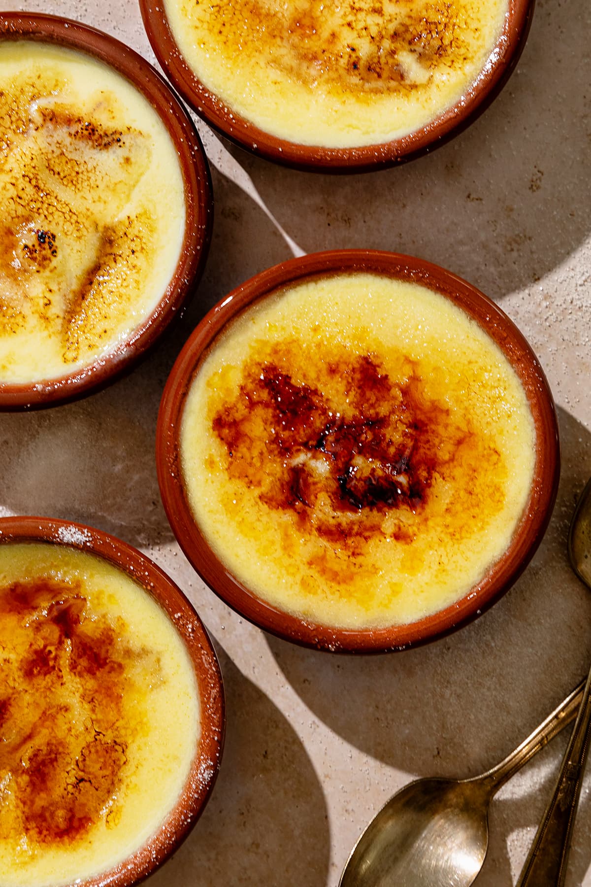 Crema Catalana in clay pots with caramelized sugar