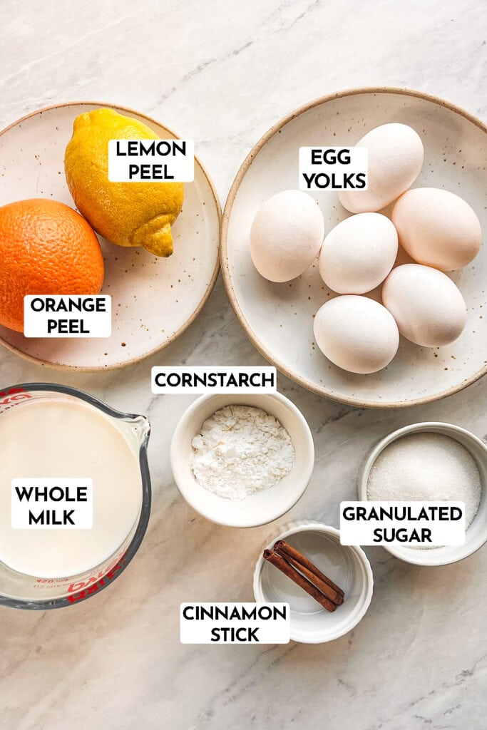 ingredients to make Crema Catalana: lemon peel, orange peel, egg yolks, cornstarch, whole milk, granulated sugar, cinnamon stick
