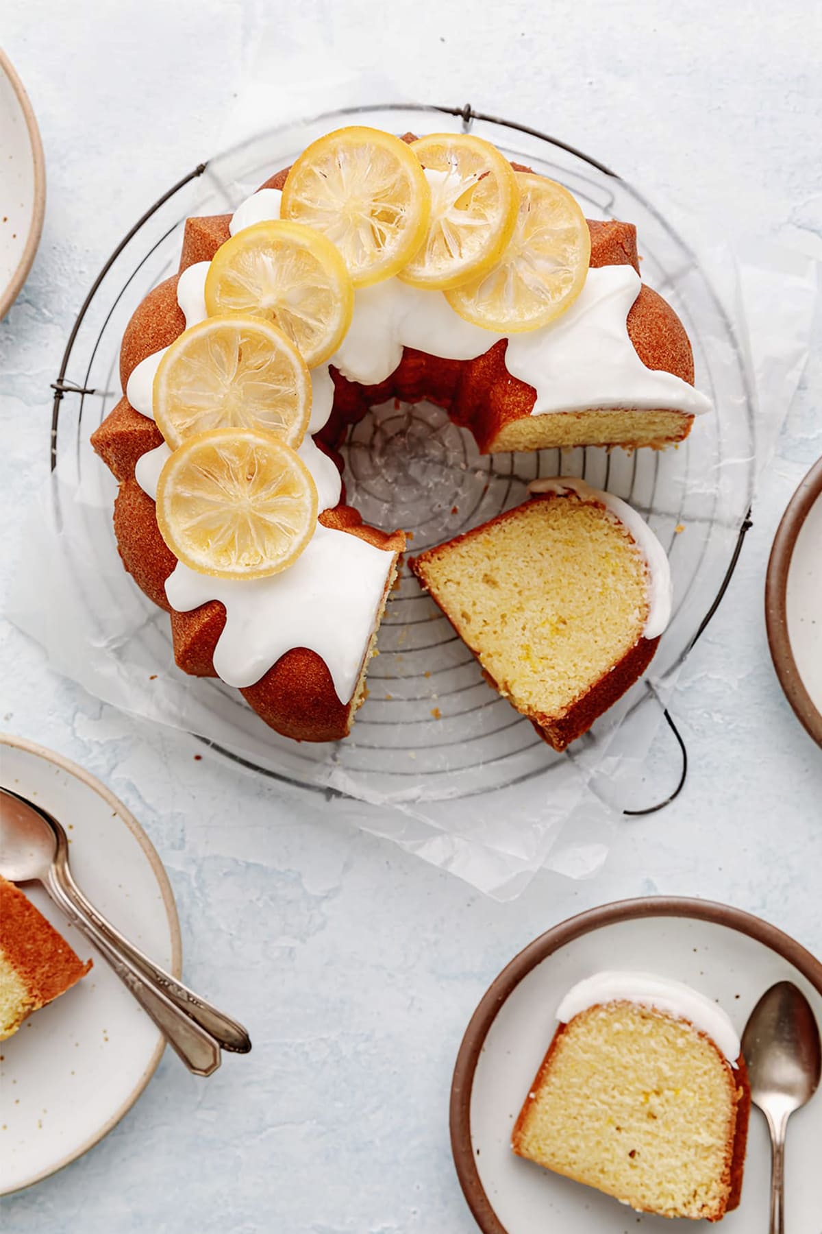 glazed lemon bundt cake with lemon icing and decorated with dried lemons