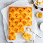 This Easy Pineapple Upside-down Cake is soft and buttery with caramelized pineapple rings and cherries on top. This recipe uses boxed cake mix and is the perfect summer snack to enjoy with friends and family.