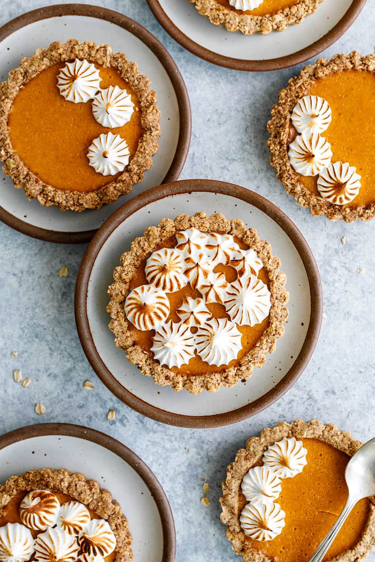 Mini Pumpkin Tarts bursting with fall flavors that are so simple to make and so good. Made with a gluten-free crust and a creamy pumpkin spice filling. Topped with toasted meringue.